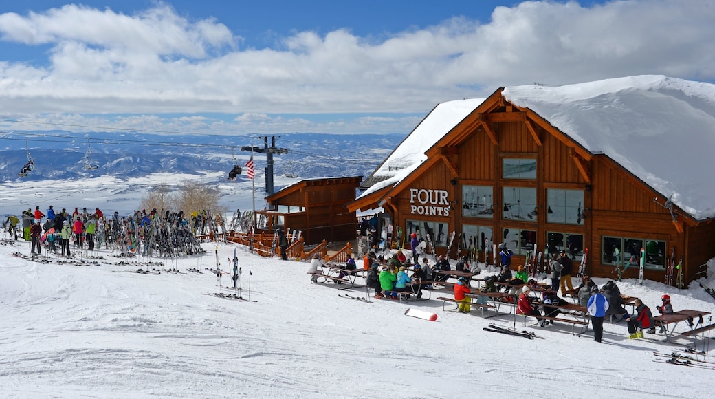 Steamboat Ski Resort which includes snow skiing and snow as well as a large group of people