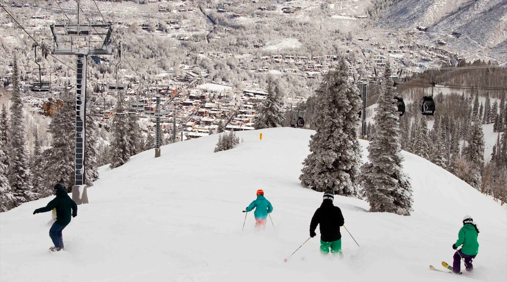 Aspen Mountain which includes a small town or village, snow boarding and snow skiing