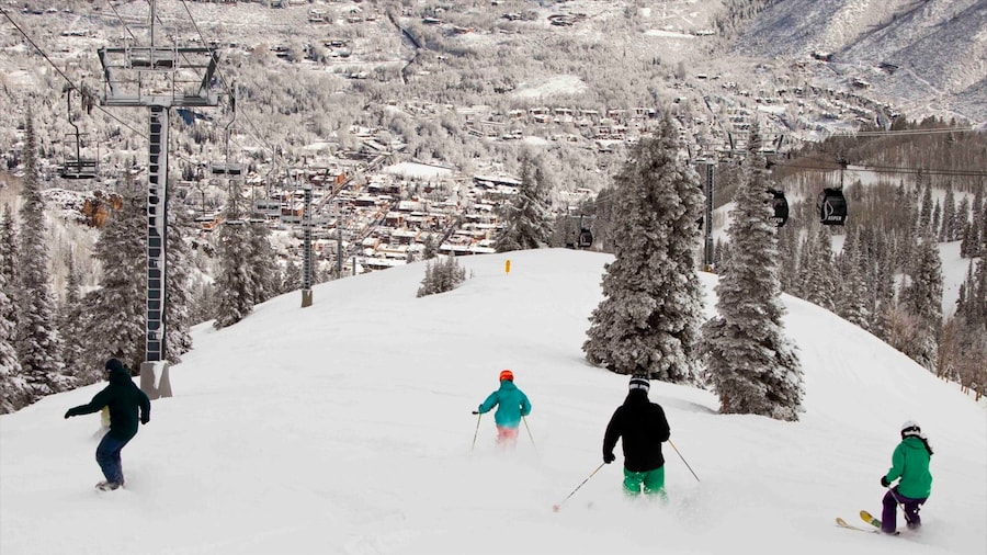 Aspen Mountain which includes a small town or village, snow boarding and snow skiing