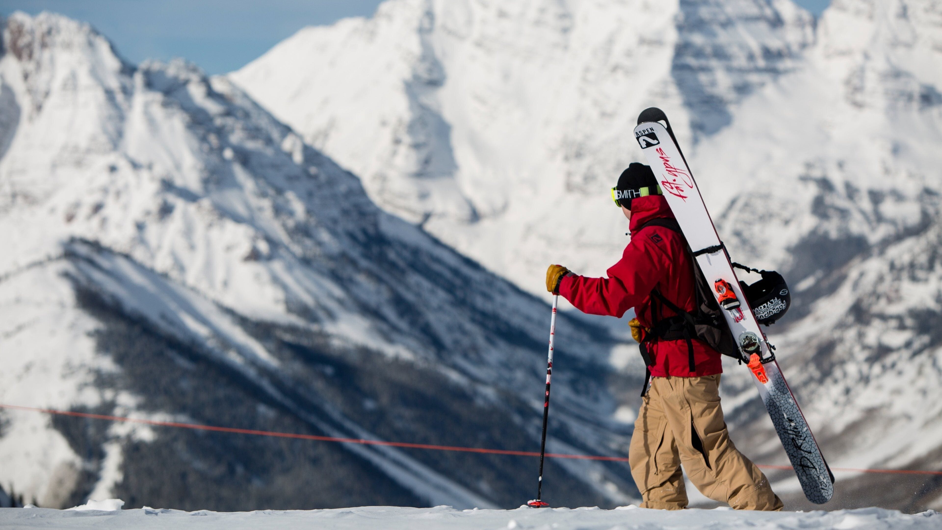 Aspen Highlands featuring snow shoeing and snow as well as an individual male
