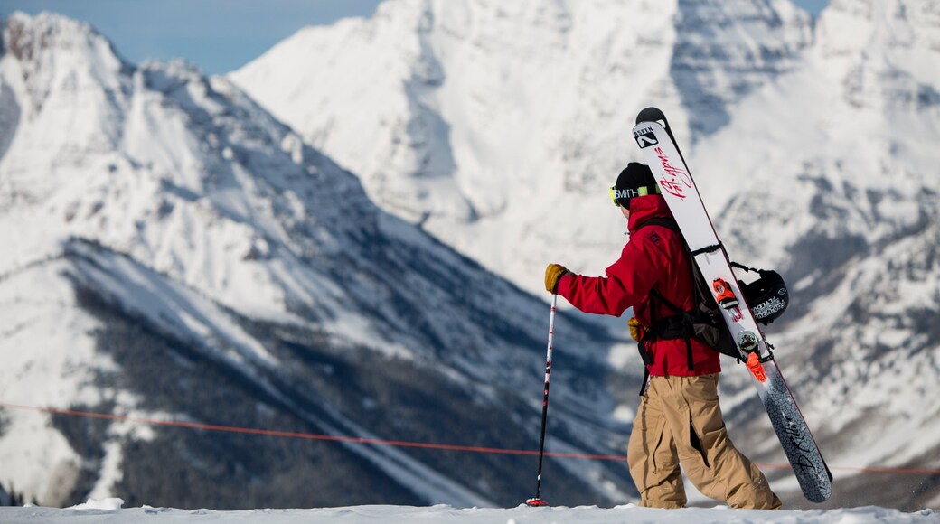 Aspen Highlands featuring snow shoeing and snow as well as an individual male