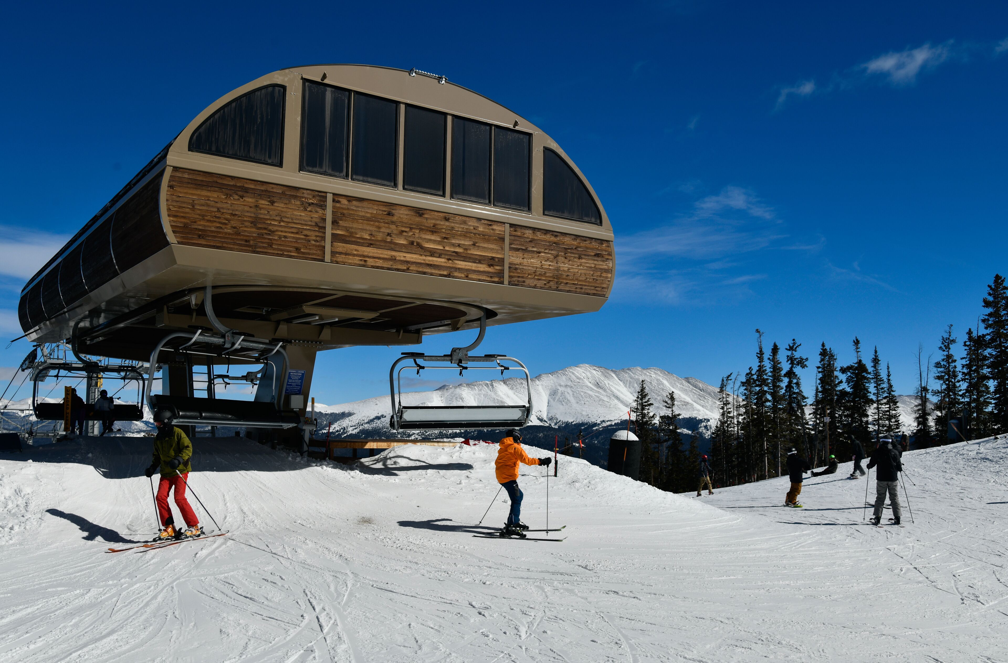 Ski lift at Breckenridge ski resort in winter time with snow in the Colorado Rocky Mountains.