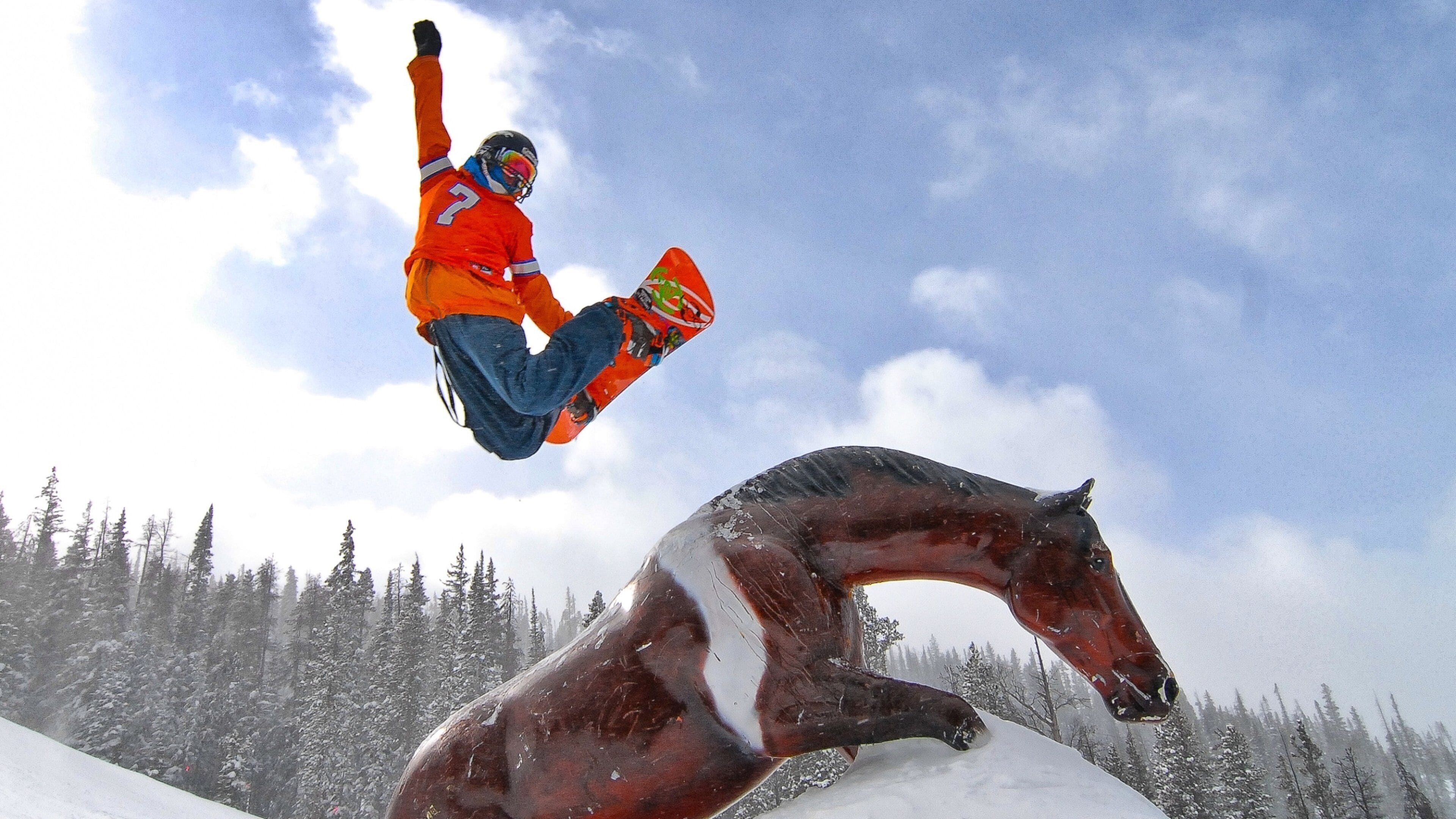 Winter Park Ski Resort featuring snow boarding and snow as well as an individual male