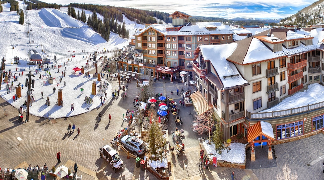 Copper Mountain Ski Resort which includes a luxury hotel or resort and snow as well as a large group of people