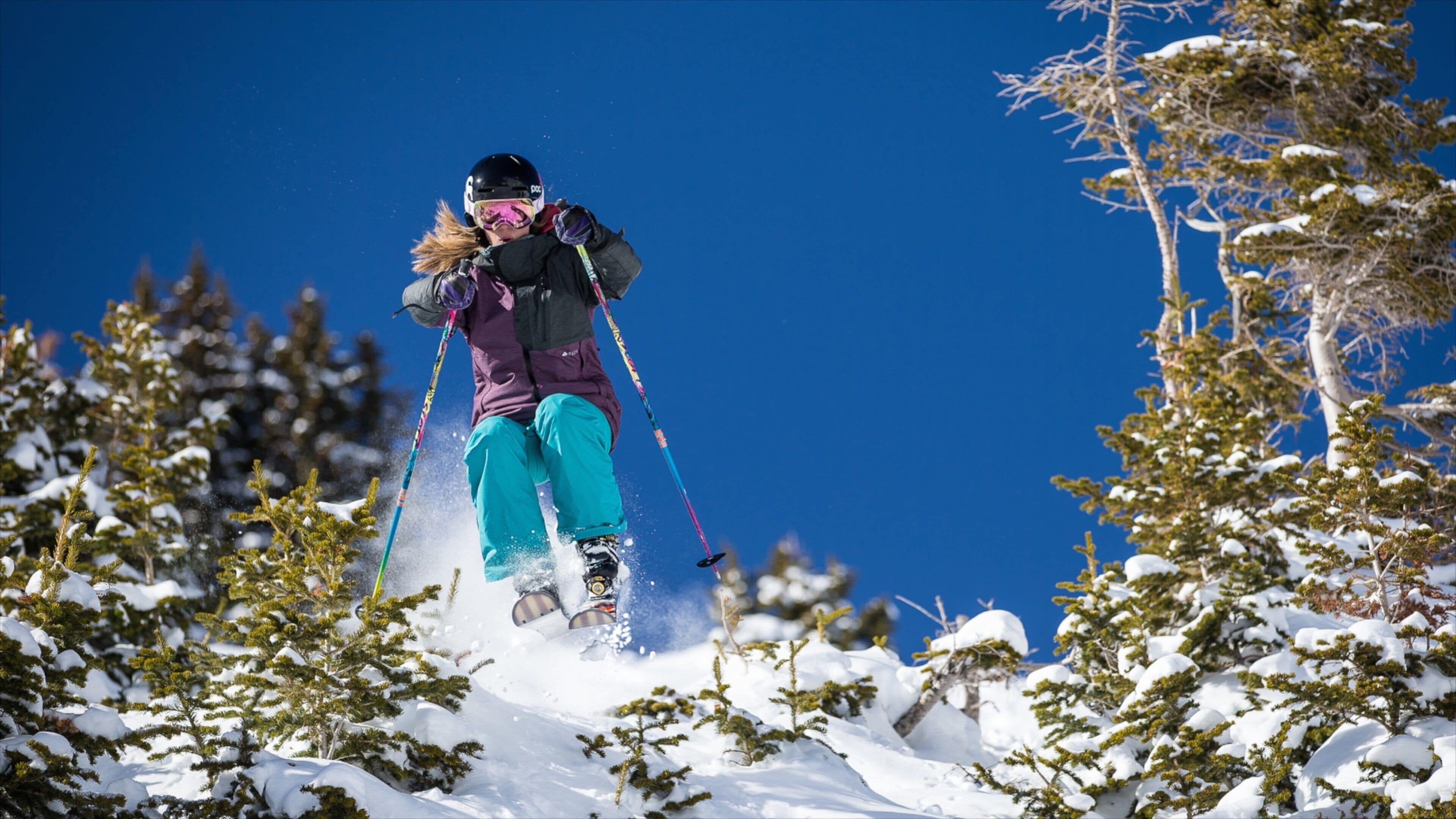 Arapahoe Basin skiområde som inkluderer skikjøring og snø i tillegg til en kvinne