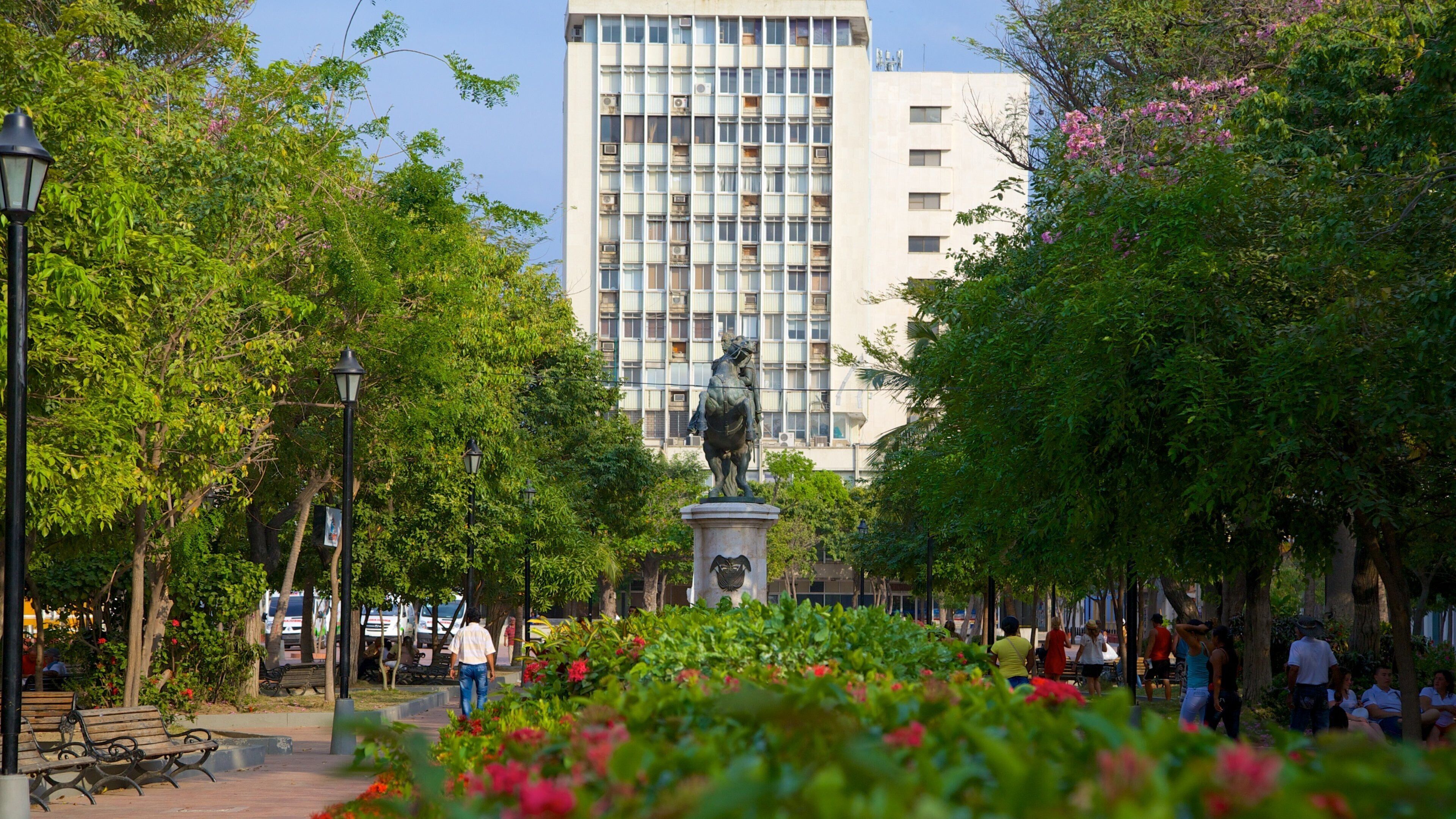 Plaza de Bolívar which includes a garden and a statue or sculpture
