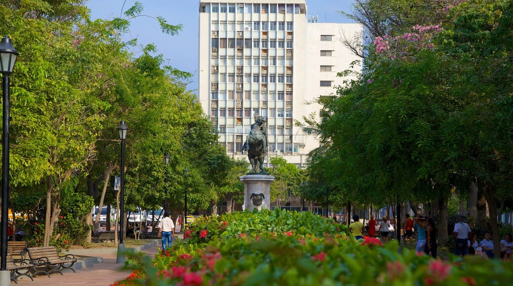 Plaza de Bolívar which includes a garden and a statue or sculpture