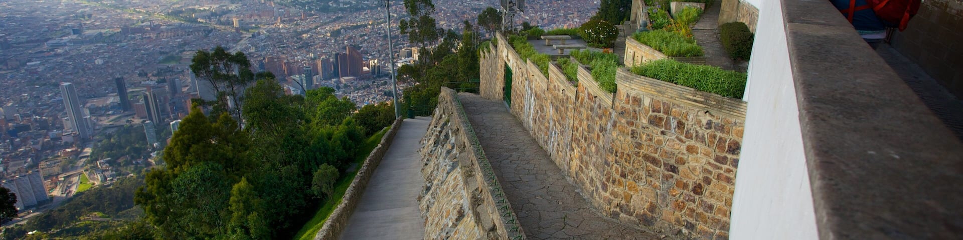 Monserrate which includes a city and views as well as an individual femail