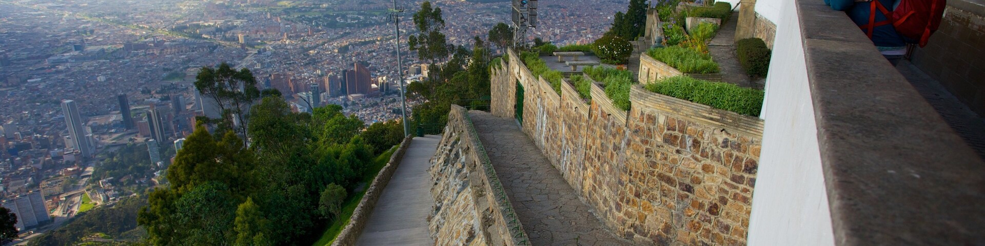 Monserrate which includes a city and views as well as an individual femail
