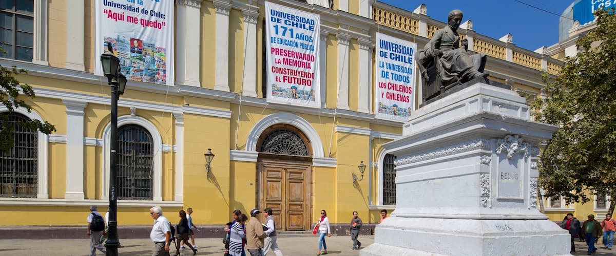 University of Chile which includes a statue or sculpture and street scenes as well as a large group of people