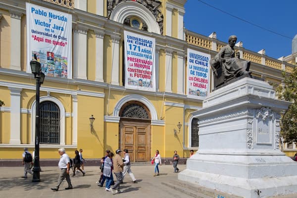 University of Chile which includes a statue or sculpture and street scenes as well as a large group of people