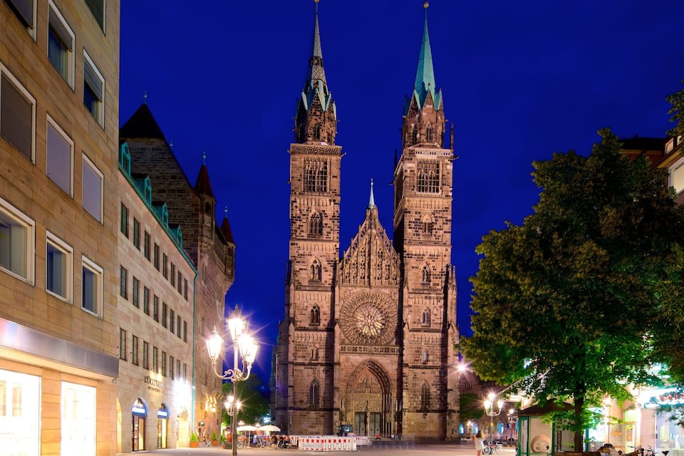 A historic cathedral with twin spires and intricate architecture.