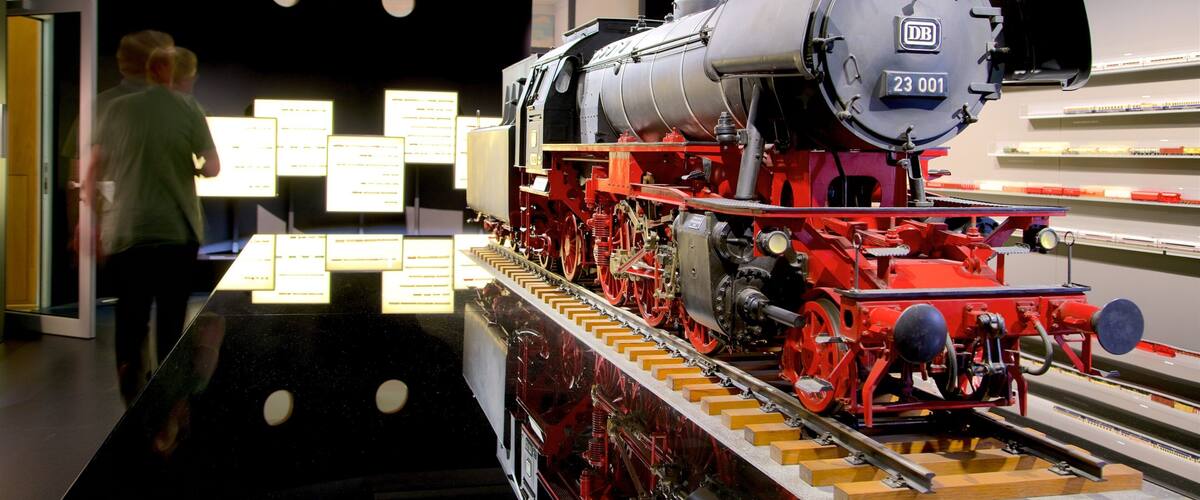 A steam locomotive with the number 23 001 displayed on its front.