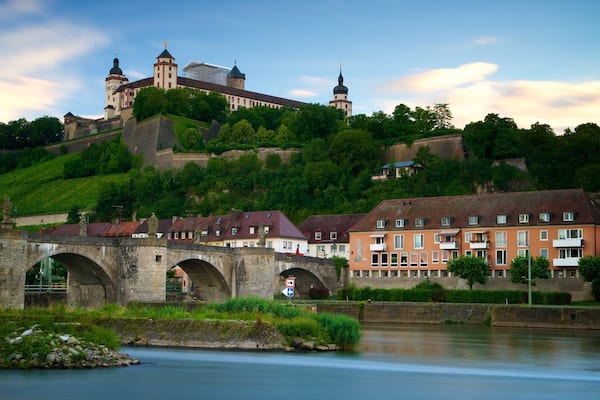 Fortress Marienberg featuring a bridge, a small town or village and a river or creek