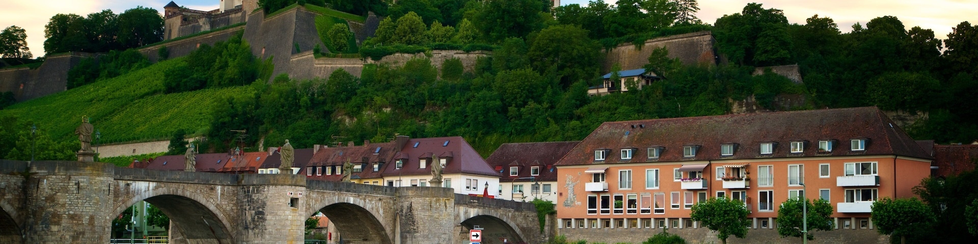 Fortress Marienberg featuring a bridge, a small town or village and a river or creek