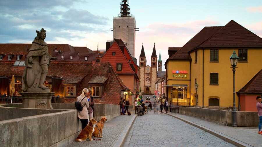 Alte Mainbruecke which includes a sunset, heritage elements and a statue or sculpture