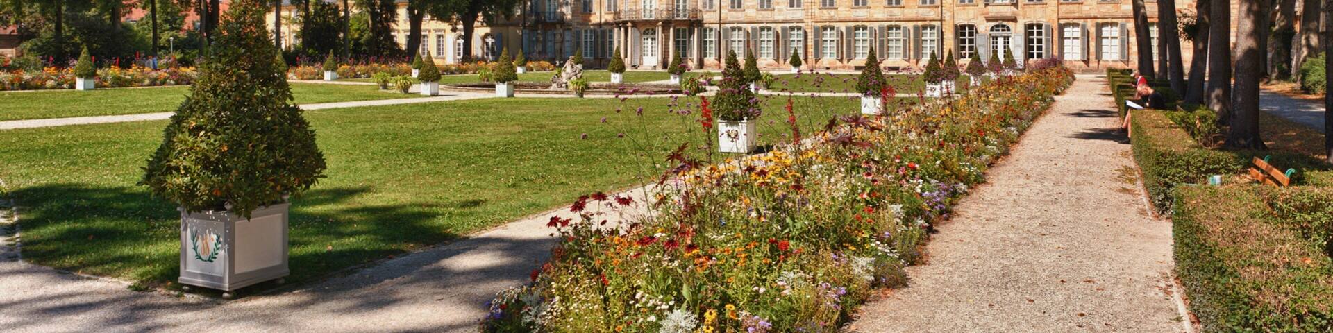 Bayreuth New Palace which includes flowers and a garden