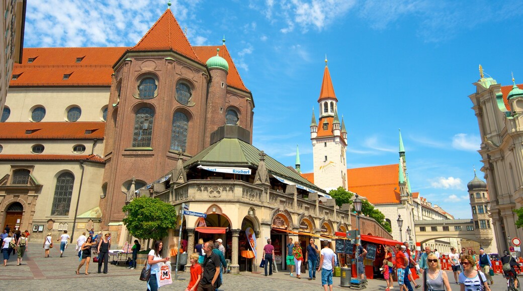 Viktualienmarkt which includes a city, a church or cathedral and heritage architecture