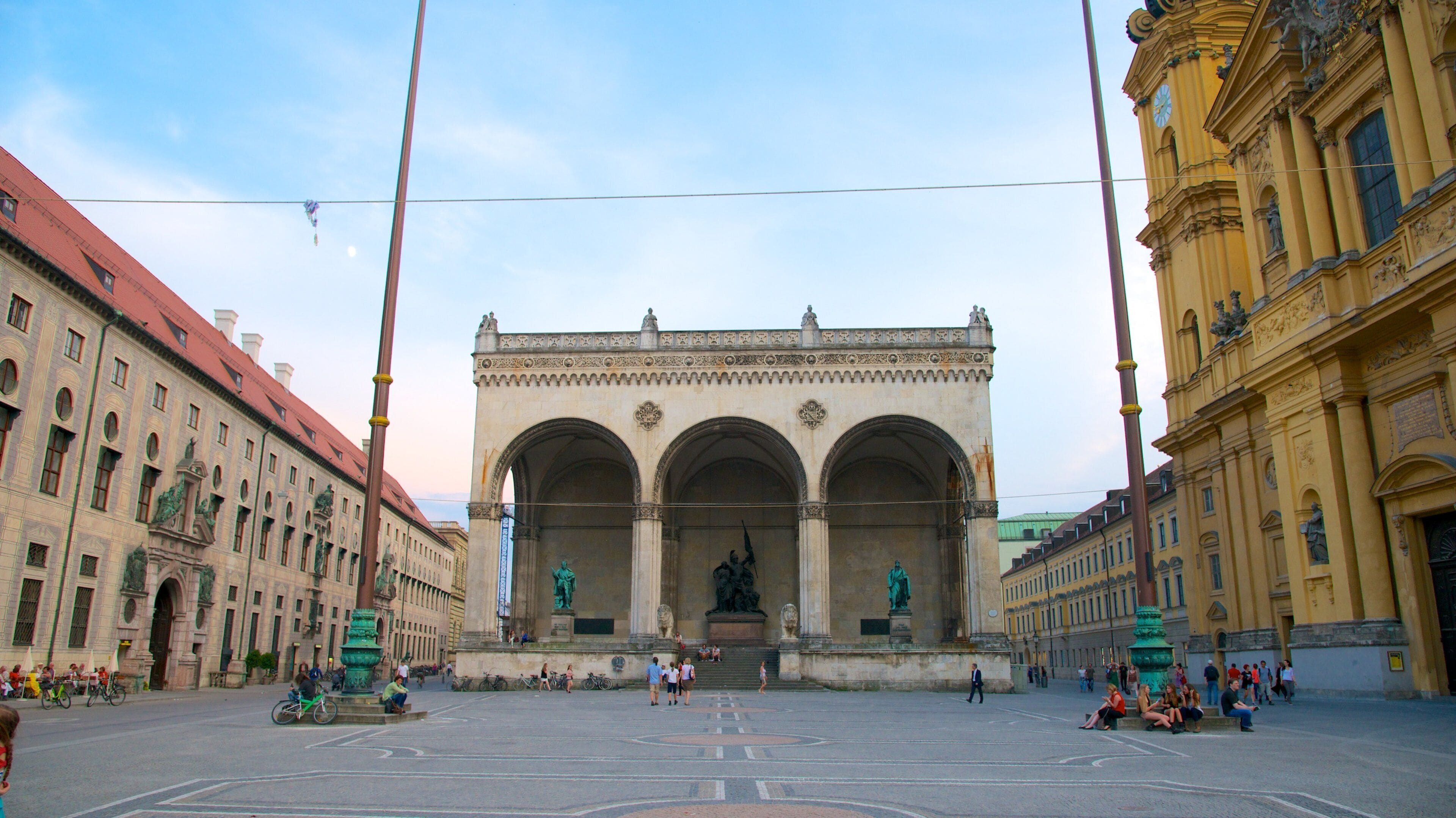 Munich City Centre showing heritage elements, a square or plaza and a sunset