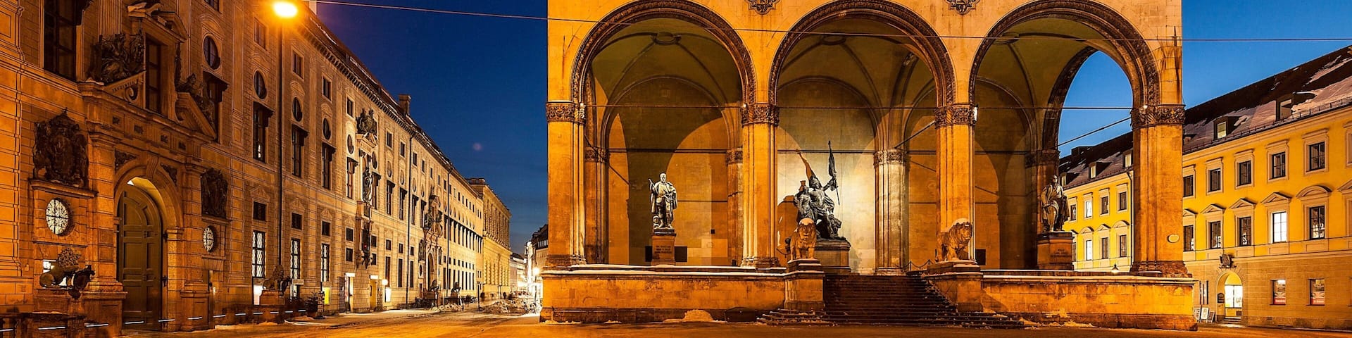 Odeonsplatz featuring heritage architecture and night scenes