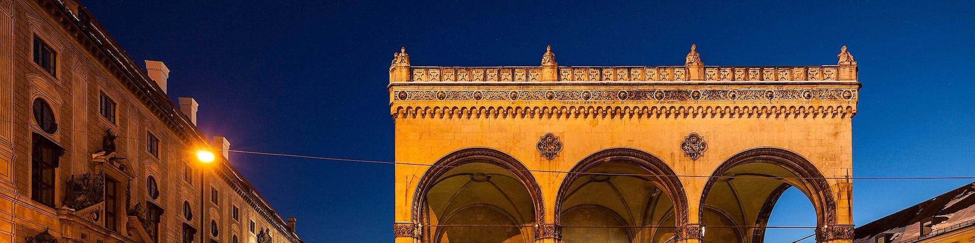 Odeonsplatz featuring heritage architecture and night scenes