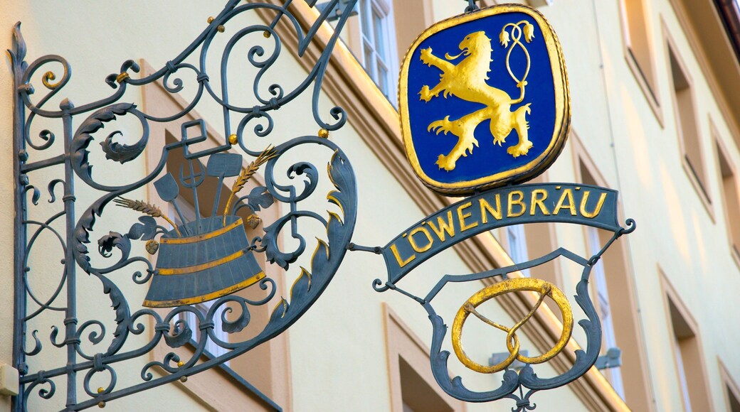 Lowenbrau featuring signage and a city