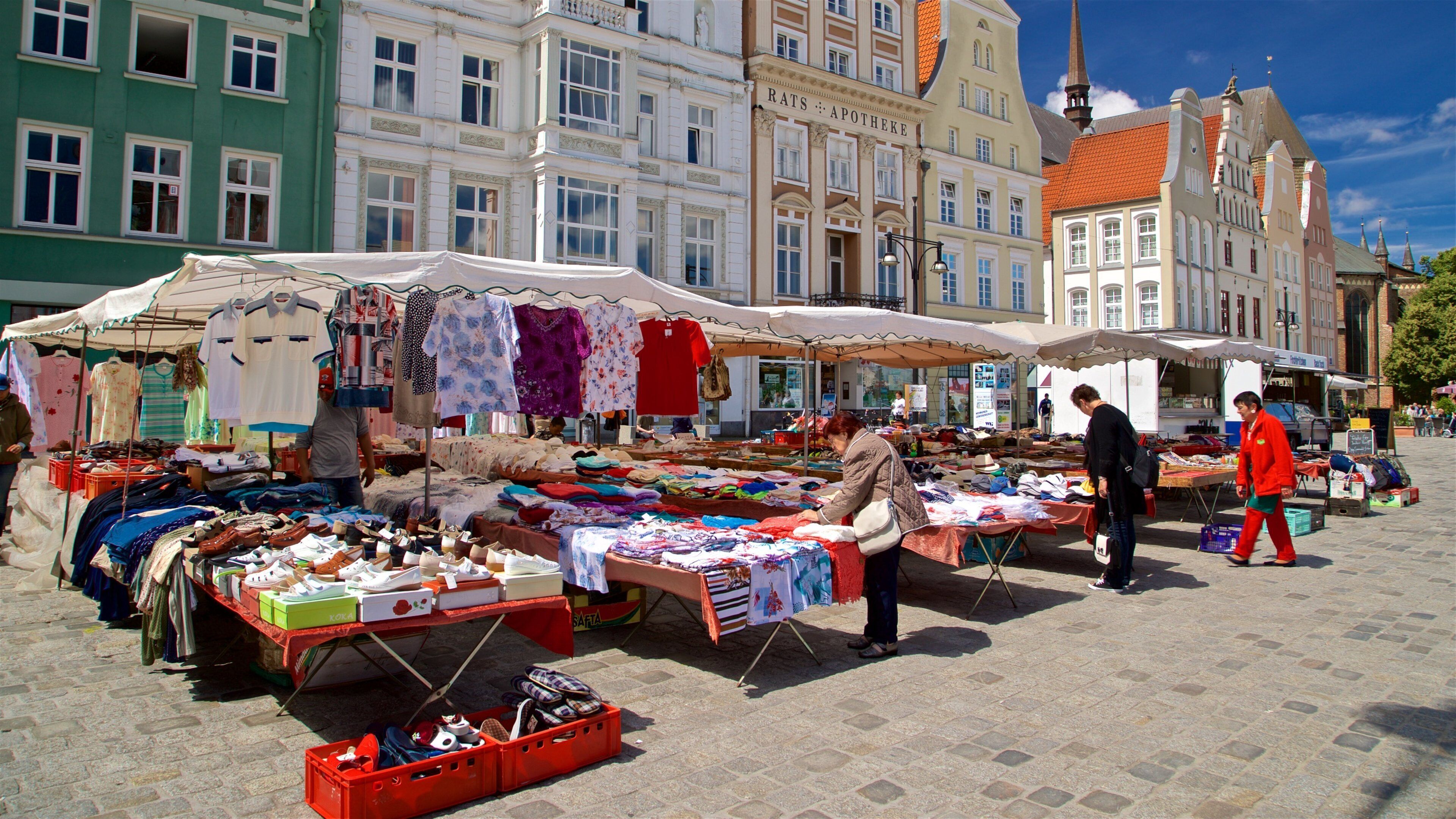 New Market featuring markets and street scenes as well as a small group of people