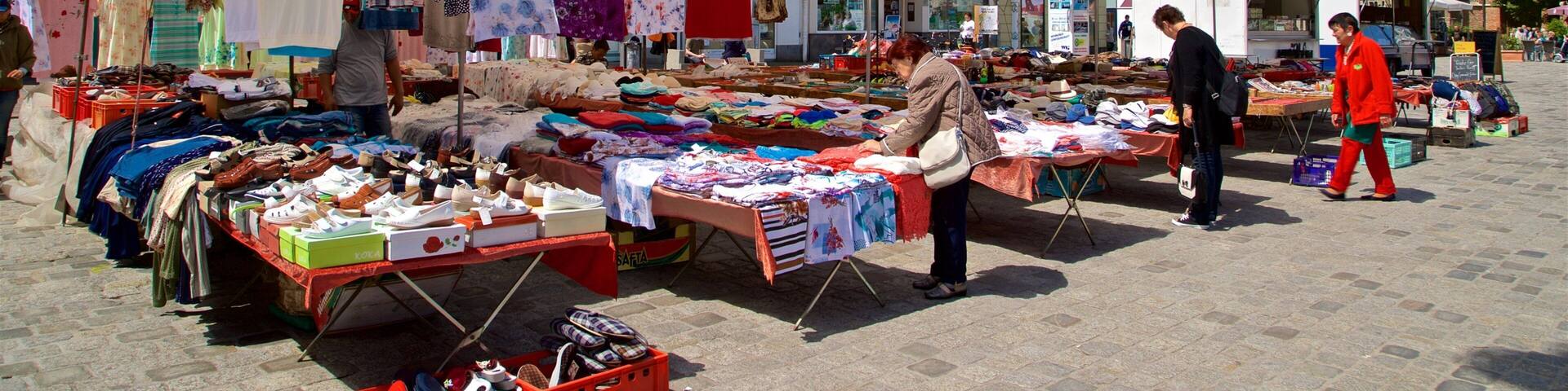 New Market which includes markets and street scenes as well as a small group of people