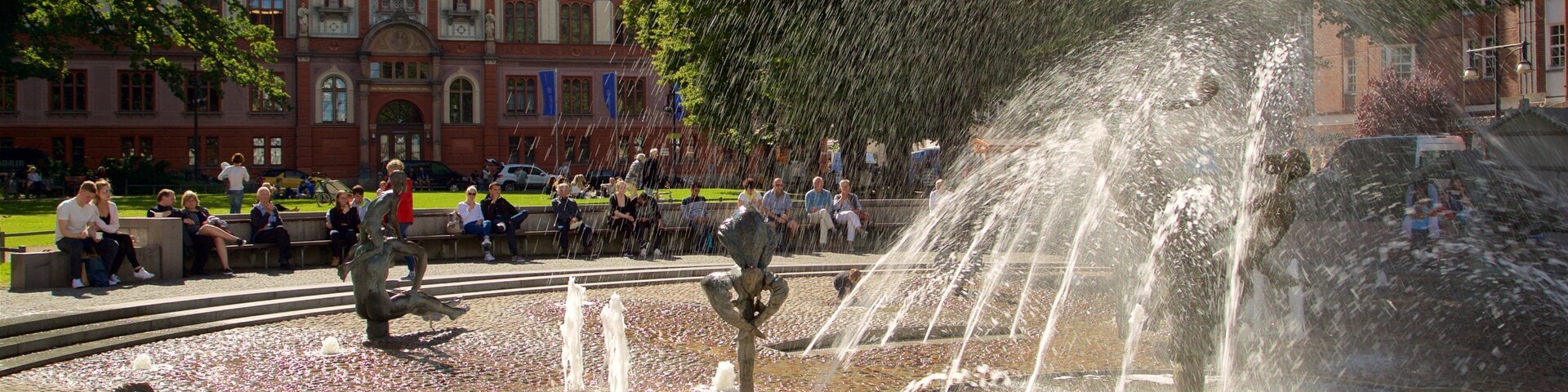 University of Rostock showing a fountain as well as a small group of people