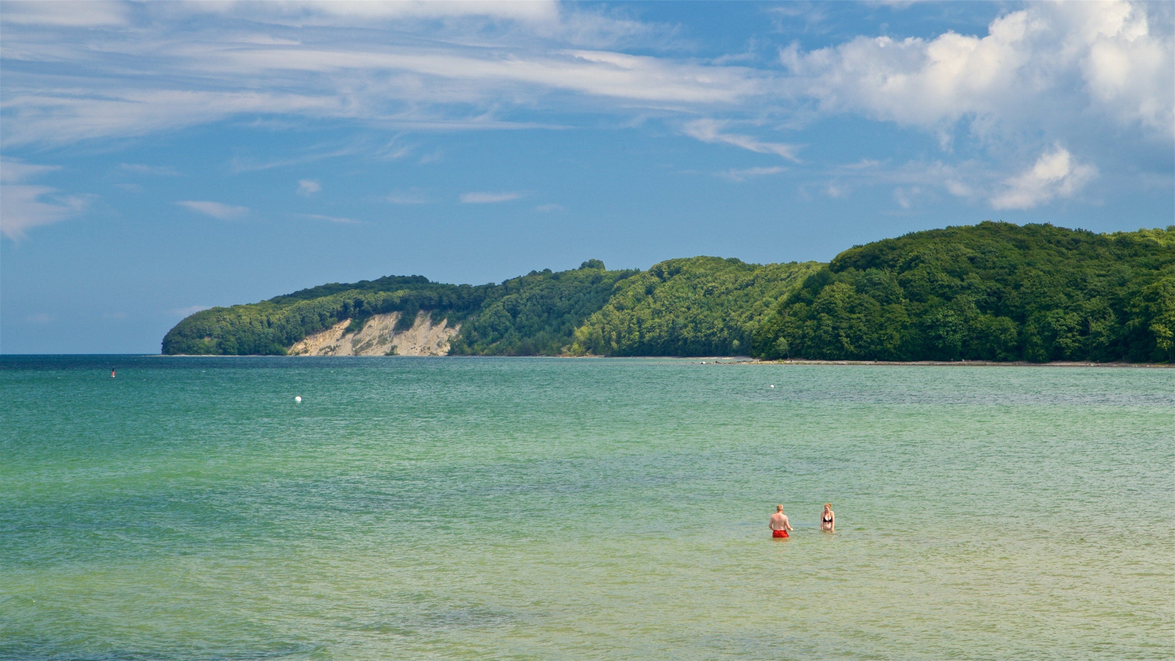 Binz Beach which includes swimming and general coastal views as well as a couple