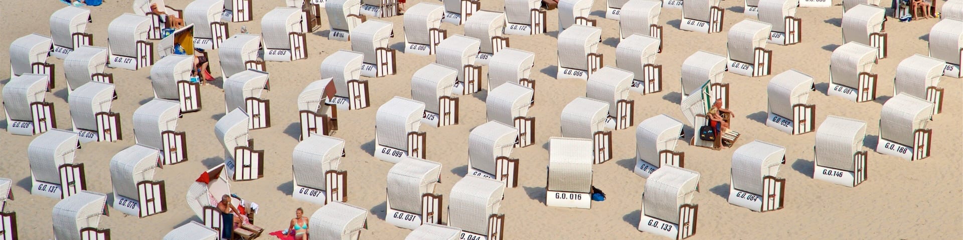 Sellin Pier featuring a beach and general coastal views as well as a small group of people