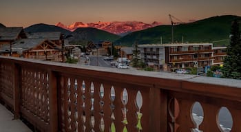 Sunset view of the mountains of Les Deux Alpes.
The village sits at 1,650 m (5,413 ft) and lifts run to 3,600 m (11,811 ft). It has the largest skiable glacier in Europe and is France's second oldest ski resort behind Chamonix, where the largest mountain in western Europe is located, Mont Blanc. It has the longest, normally open full on-piste vertical available in the world. It is a 71 km