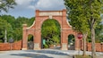 An archway with the word "OAKLAND" and a stop sign.