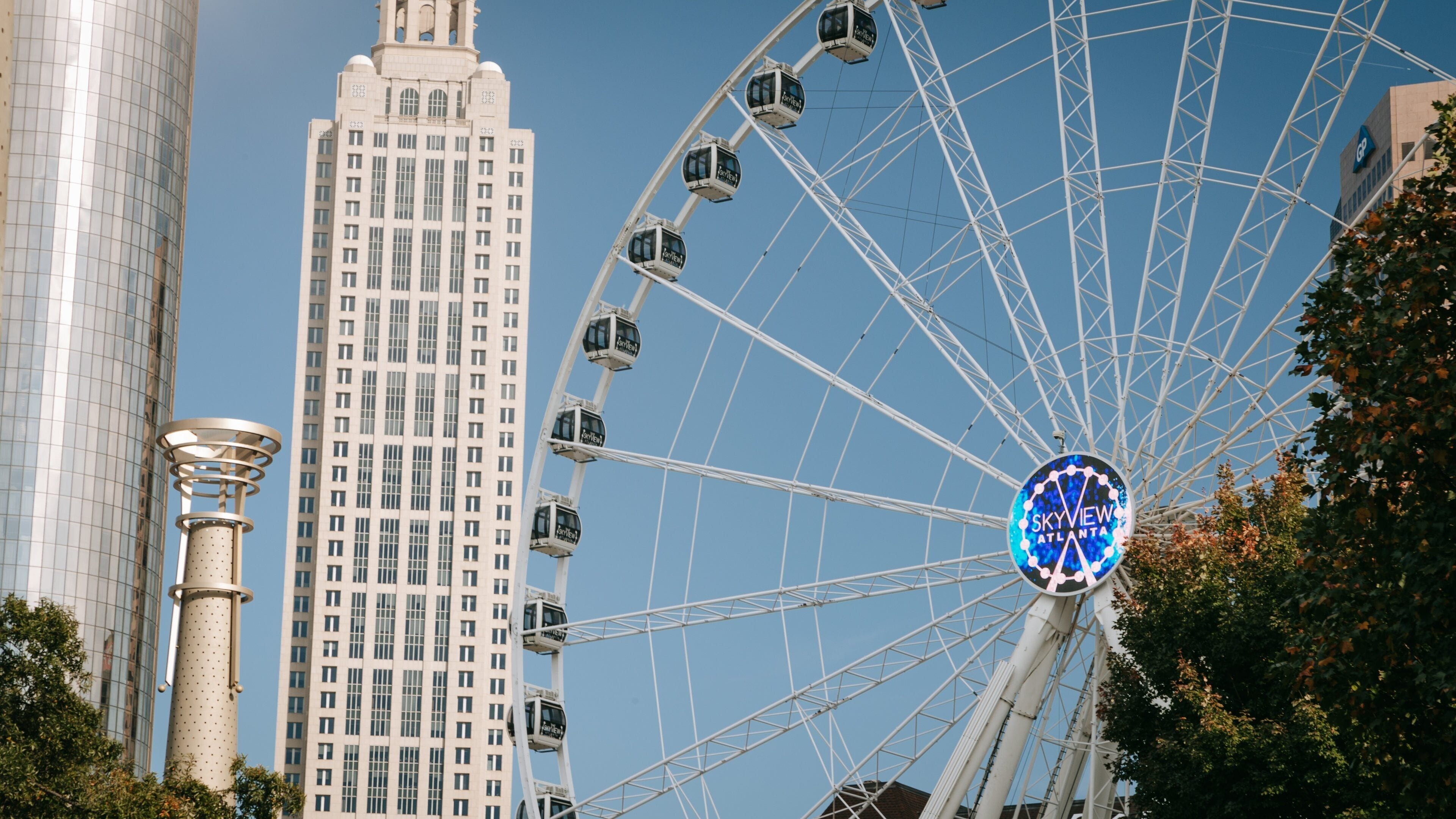 Centennial Olympic Park which includes signage, a high rise building and a city