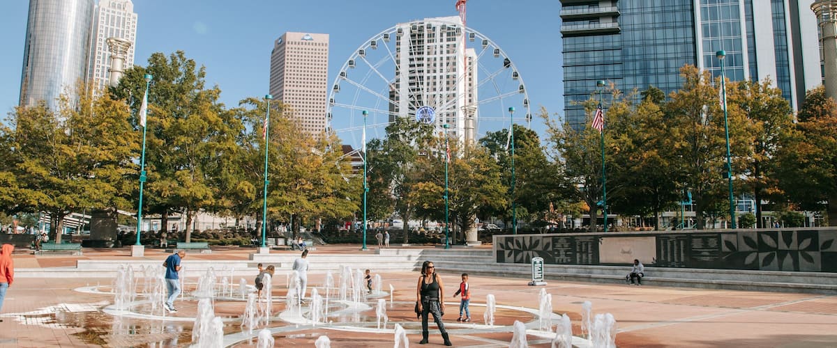 Centennial Olympic Park which includes a fountain and a square or plaza as well as a family