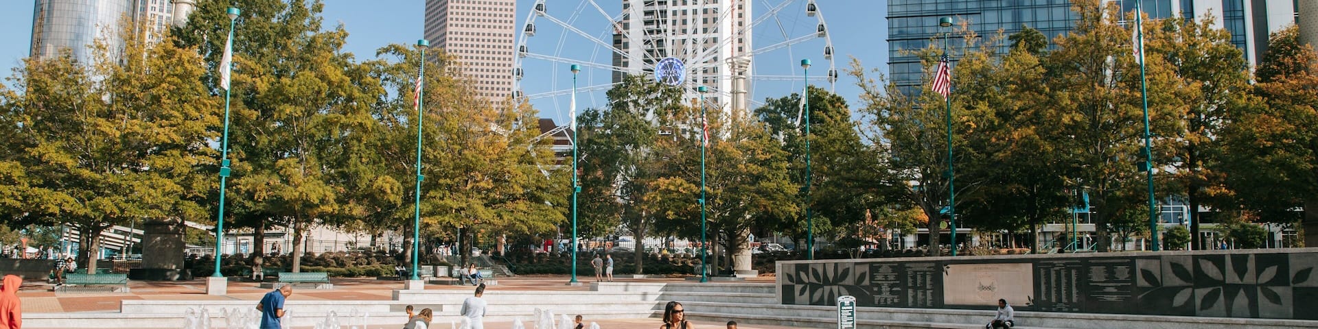 Centennial Olympic Park which includes a fountain and a square or plaza as well as a family