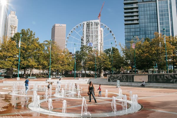 Centennial Olympic Park which includes a fountain and a square or plaza as well as a family