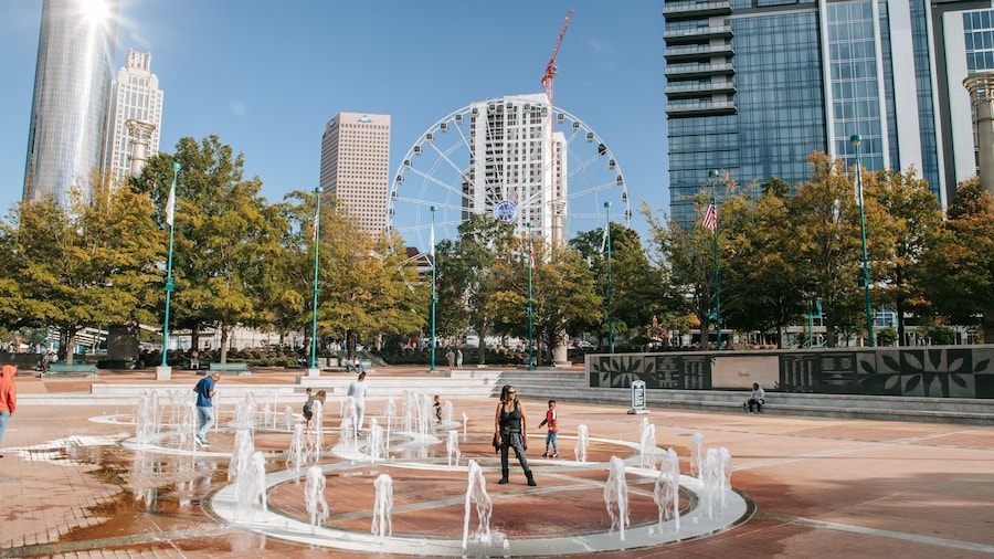 Centennial Olympic Park which includes a fountain and a square or plaza as well as a family