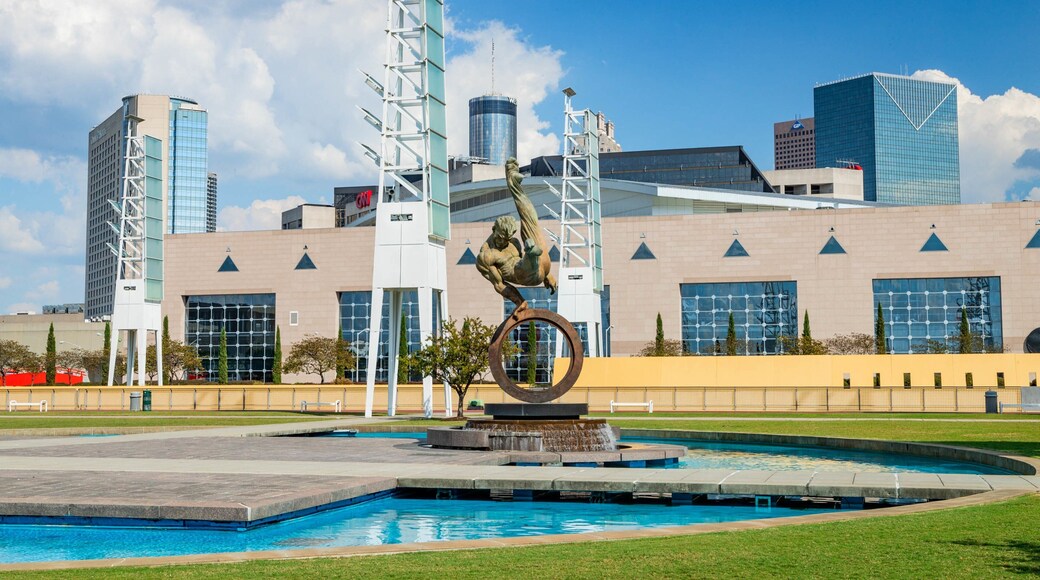 State Farm Arena featuring a fountain, a city and outdoor art