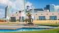State Farm Arena featuring a fountain, a city and outdoor art