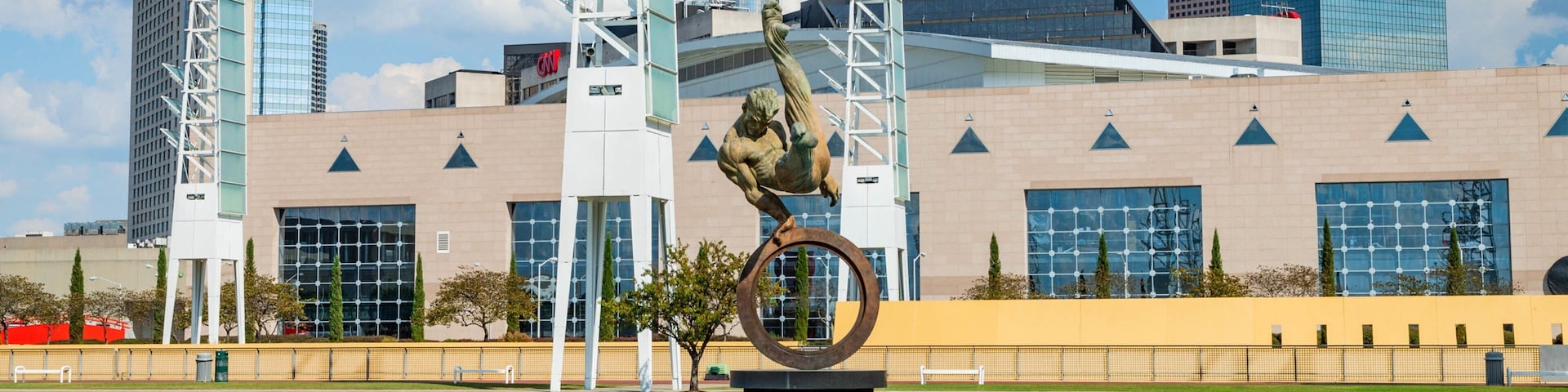 State Farm Arena featuring a fountain, a city and outdoor art