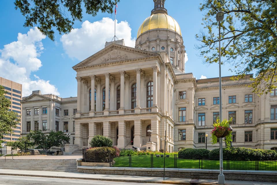 A large neoclassical building with a prominent dome and columns.