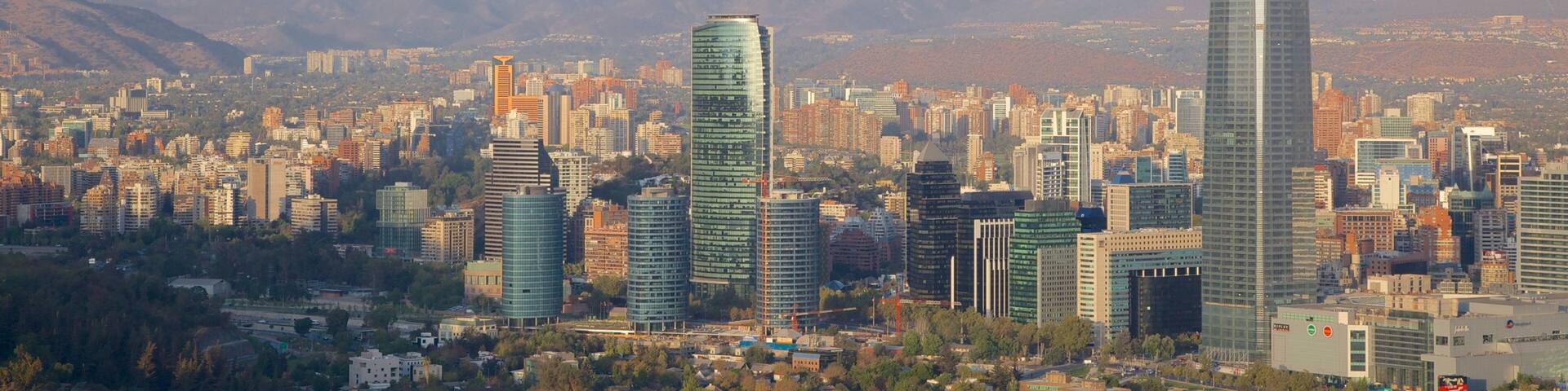San Cristobal Hill featuring mist or fog, mountains and a city