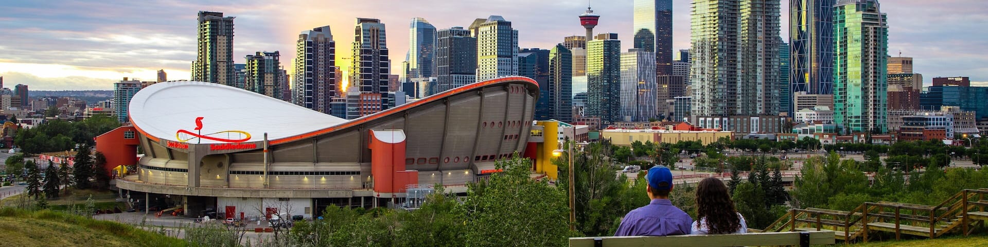 Scotiabank Saddledome featuring a park, a sunset and landscape views