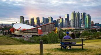 Scotiabank Saddledome featuring a park, a sunset and landscape views