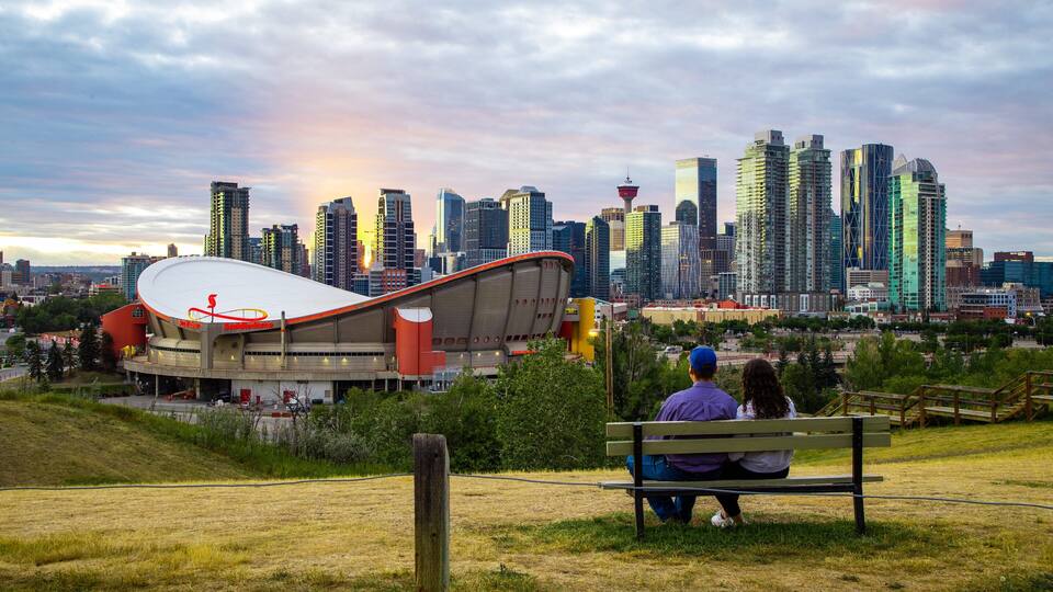Scotiabank Saddledome featuring a park, a sunset and landscape views