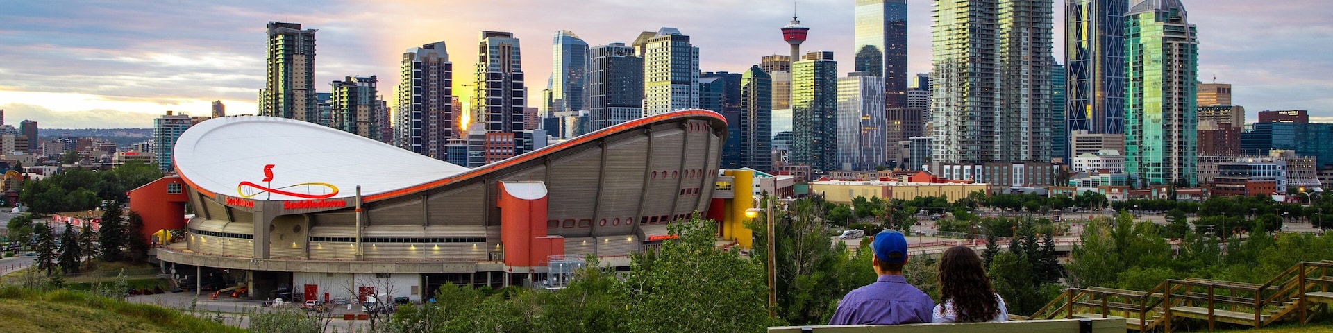 Scotiabank Saddledome featuring a park, a sunset and landscape views