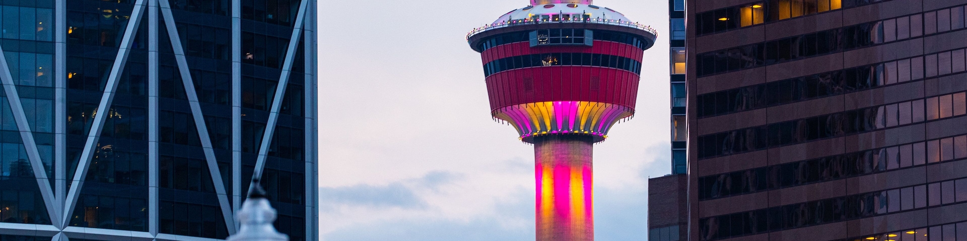 Calgary Tower which includes a high rise building, a city and views