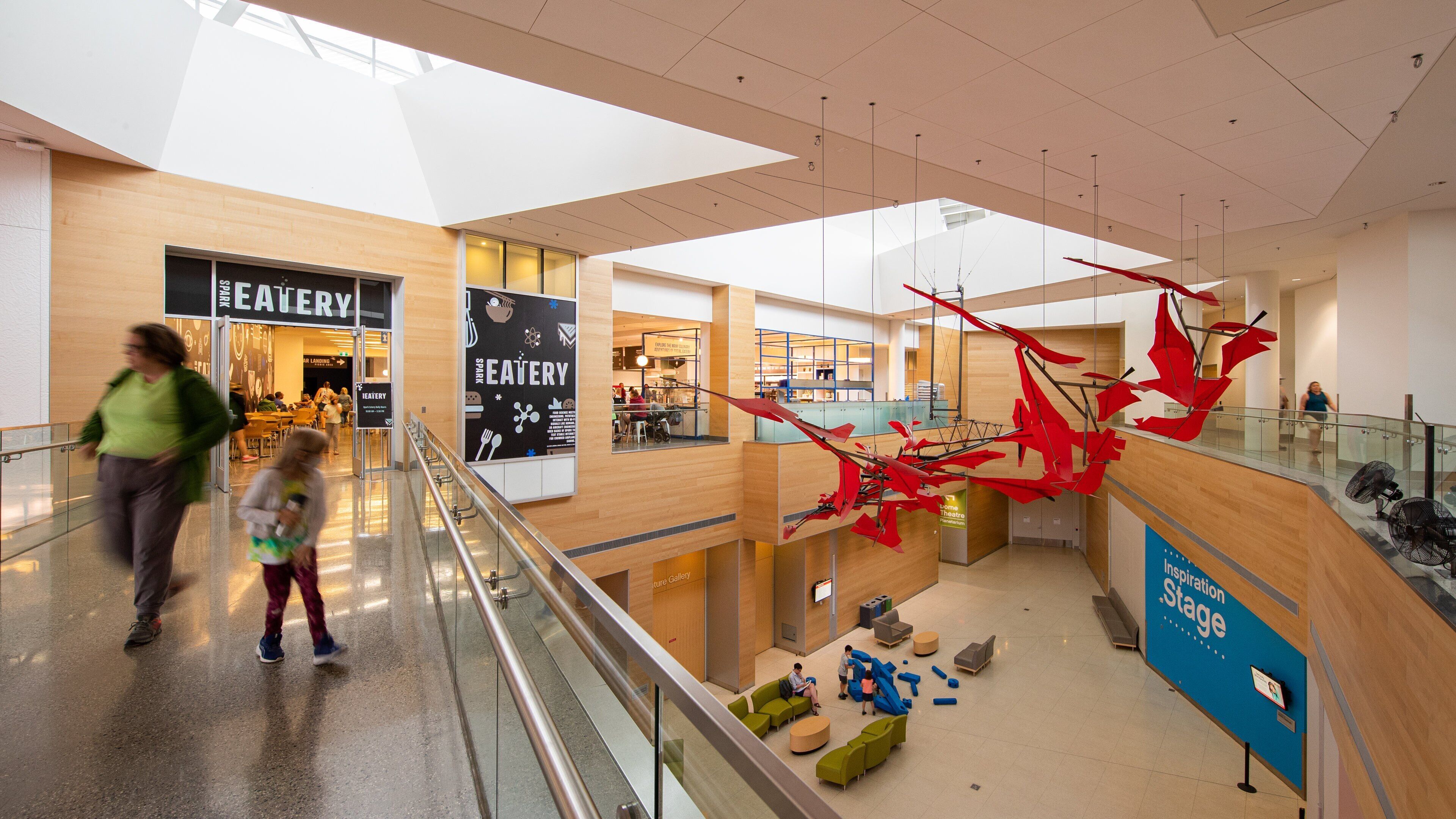 TELUS Spark featuring interior views as well as a family