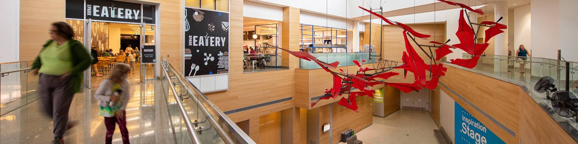 TELUS Spark featuring interior views as well as a family